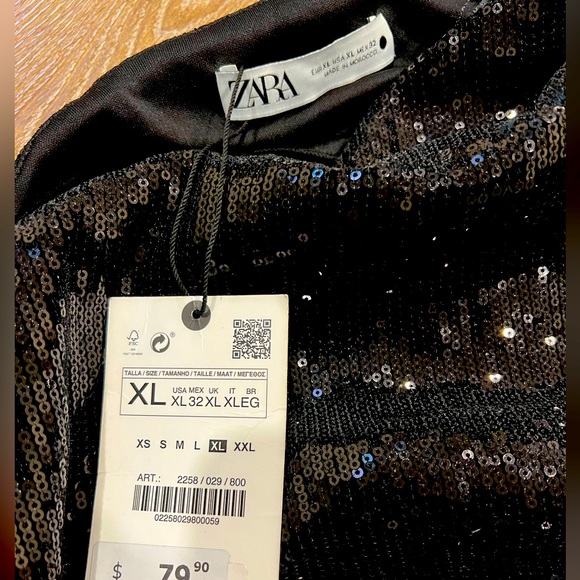 Black dress, goes down to knee. Would fit on you if you usually wear medium. - Picture 4 of 4